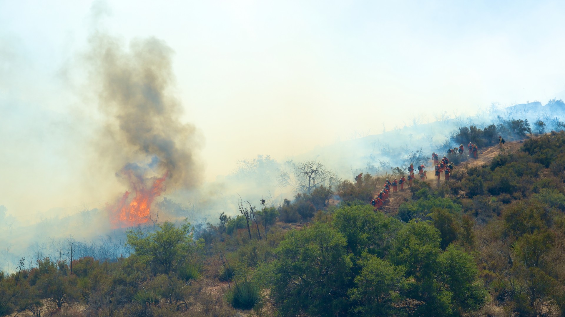 flame burst near california firefighters