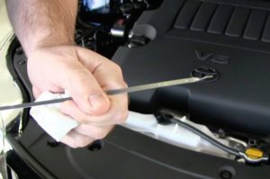 dipstick for checking oil