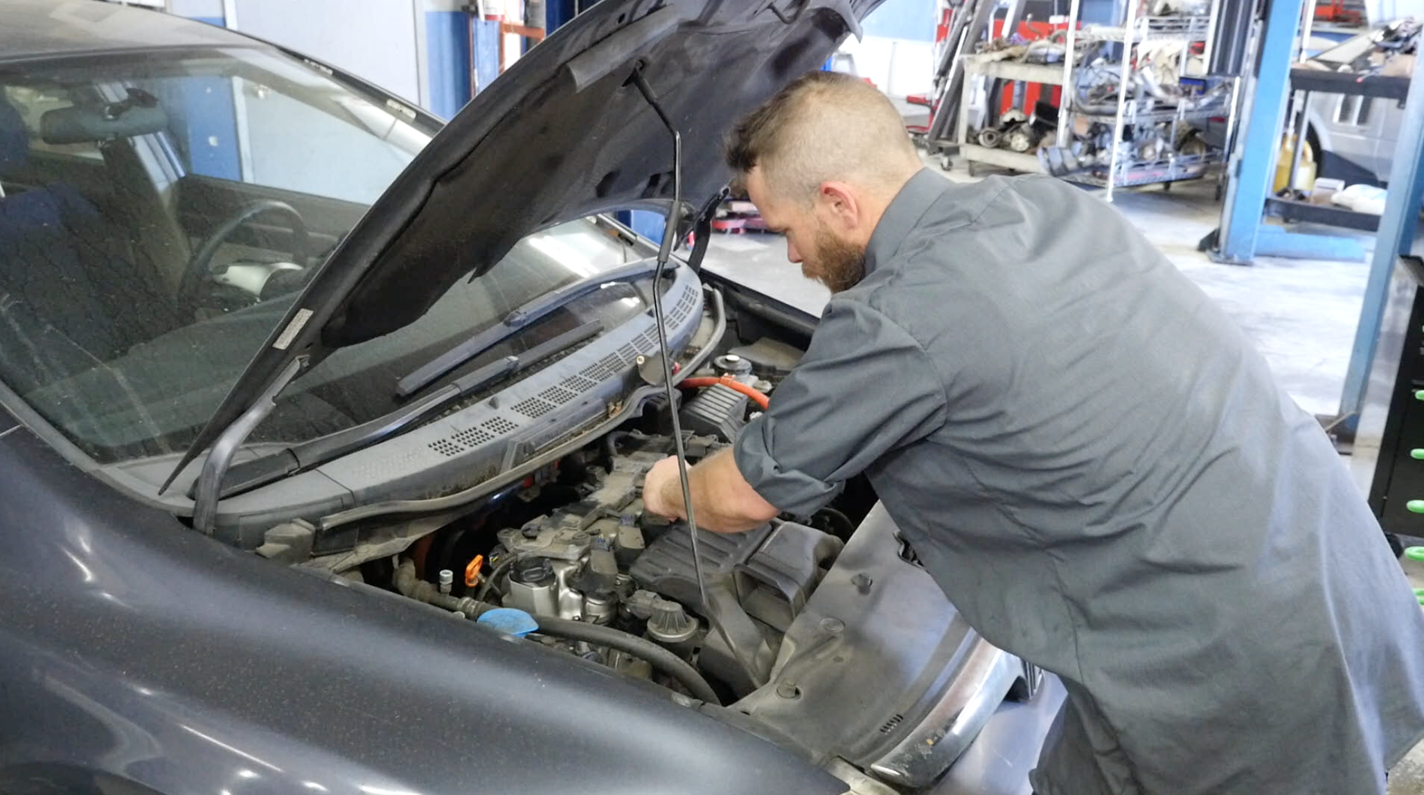 mechanic working on vehicle