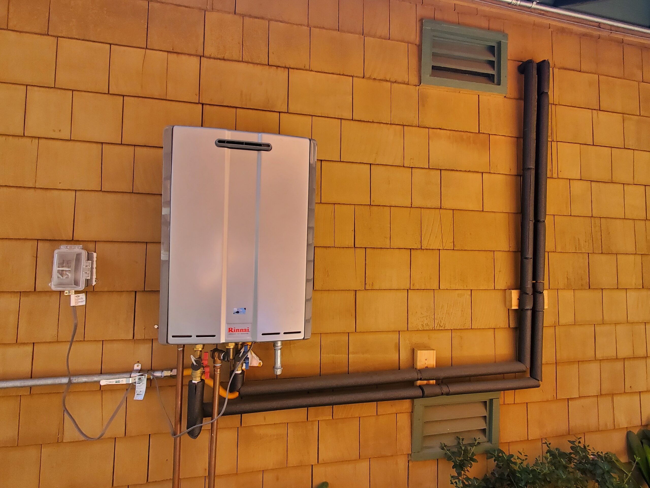 tankless water heater installed on outside of house