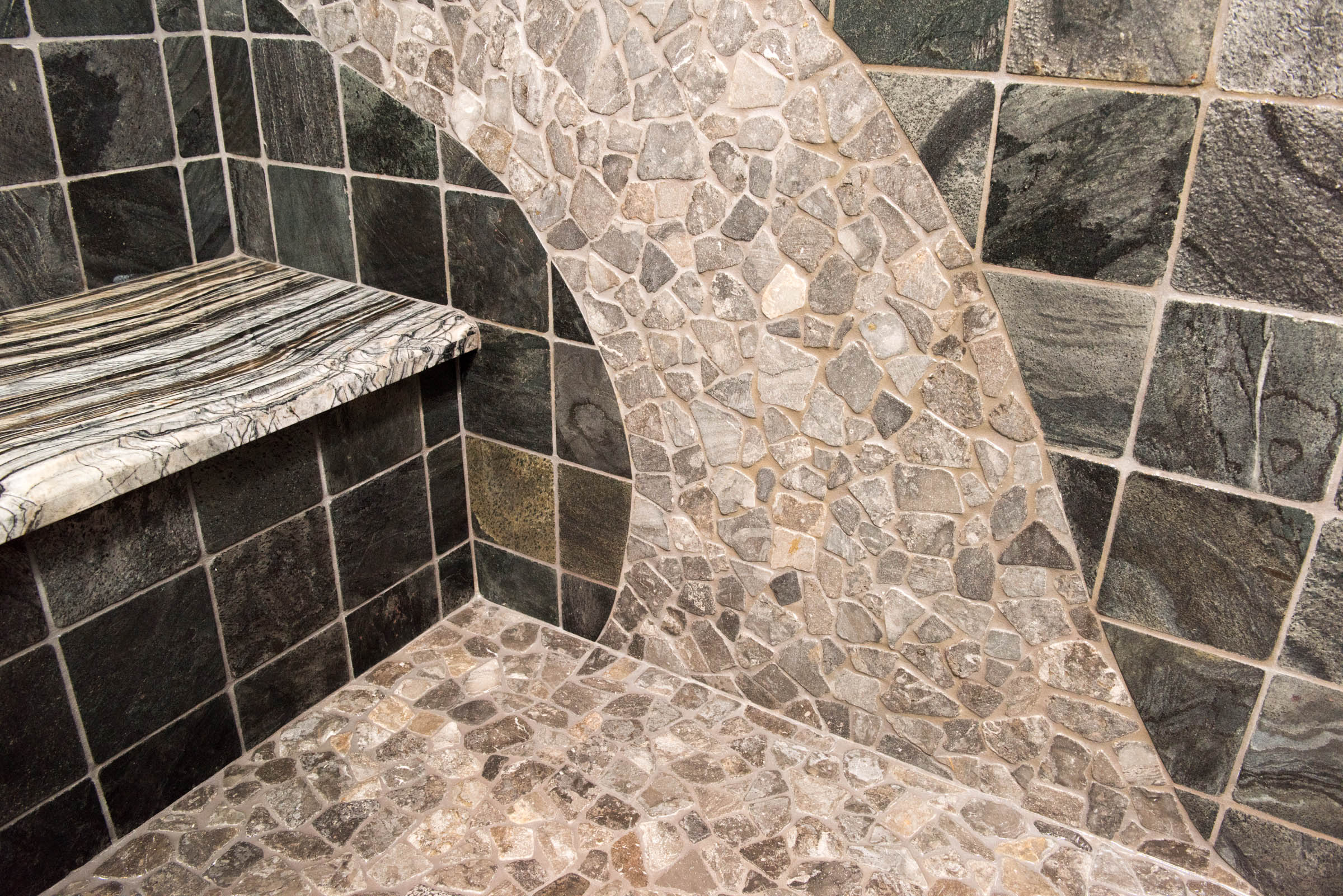 artistic tile and stone bathroom