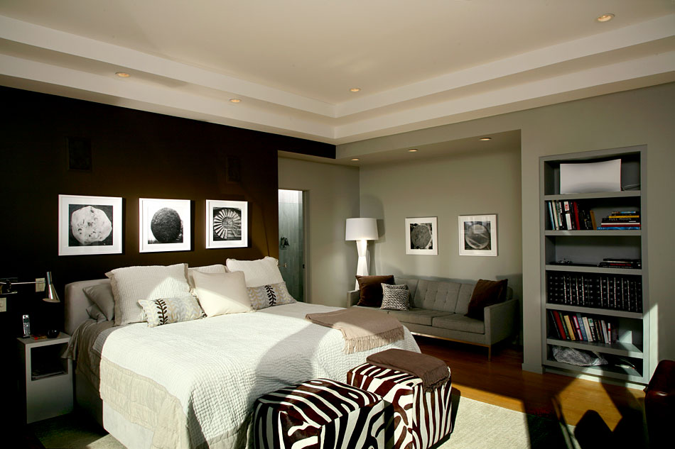 A bedroom with a black and white and zebra design